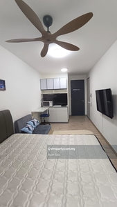 Studio unit with tv and small kitchen